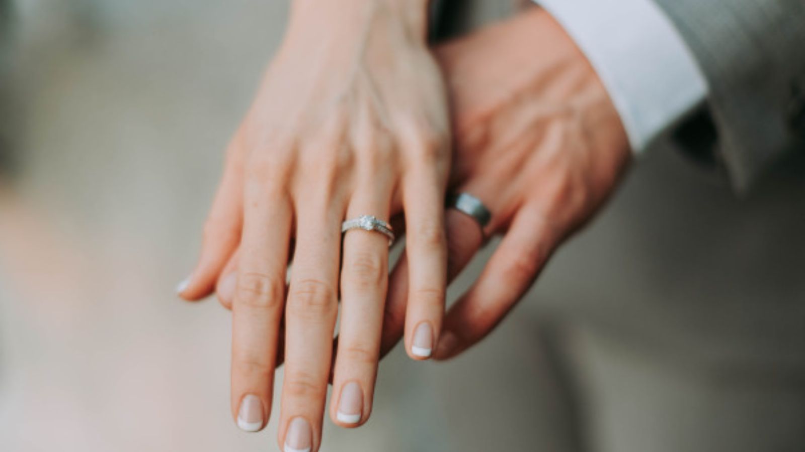 husband and wife showing their rings
